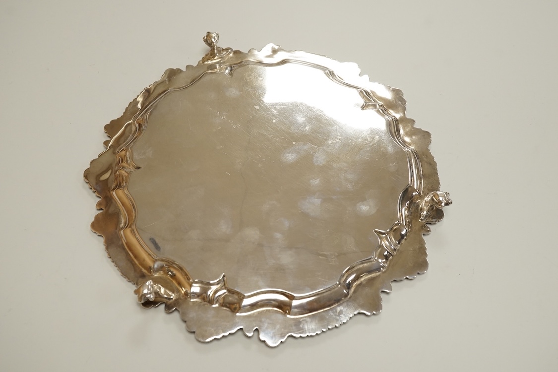 A George V silver waiter, with engraved crest and shell and scroll border, Deykin & Harrison, Birmingham, 1910, 21.5cm, 8.9oz.